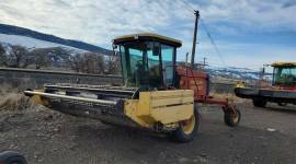 2000 New Holland HW320 Self-Propelled Windrowers a