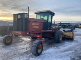 1999 New Holland HW300 Self-Propelled Windrowers a