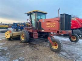 1999 New Holland HW300 Self-Propelled Windrowers a